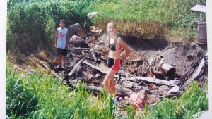 Kelly and Cletus QUINTAL exploring the remains of the HUMBKE farm home in Iowa in 1999